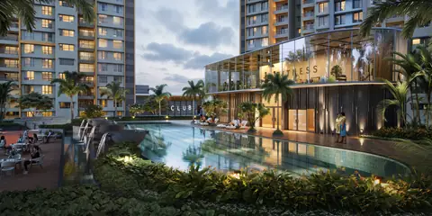 Lap pool with water features next to the glass fitness clubhouse